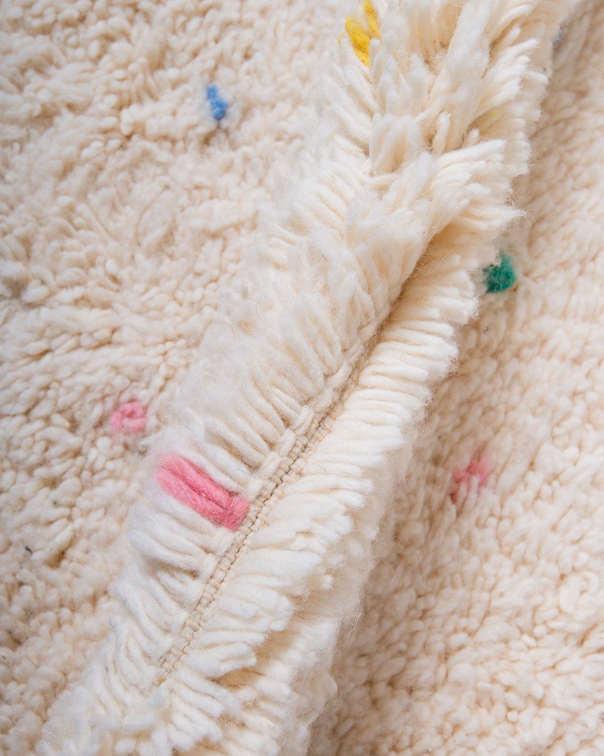 Modern, designer, handcrafted Berber rug from Morocco. Beniourain carpet with beautiful colours and patterns and fluffy wool texture.